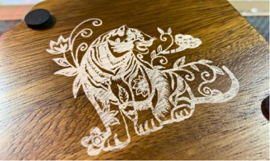 MimoWork CO2 laser engraver machine working in a workshop