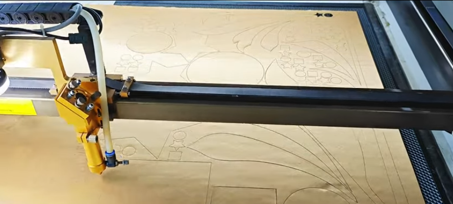 CO2 laser cutter engraving and cutting plywood